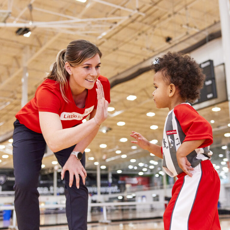 a person and a child playing football