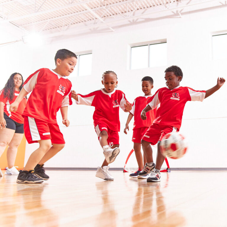 a group of kids playing football